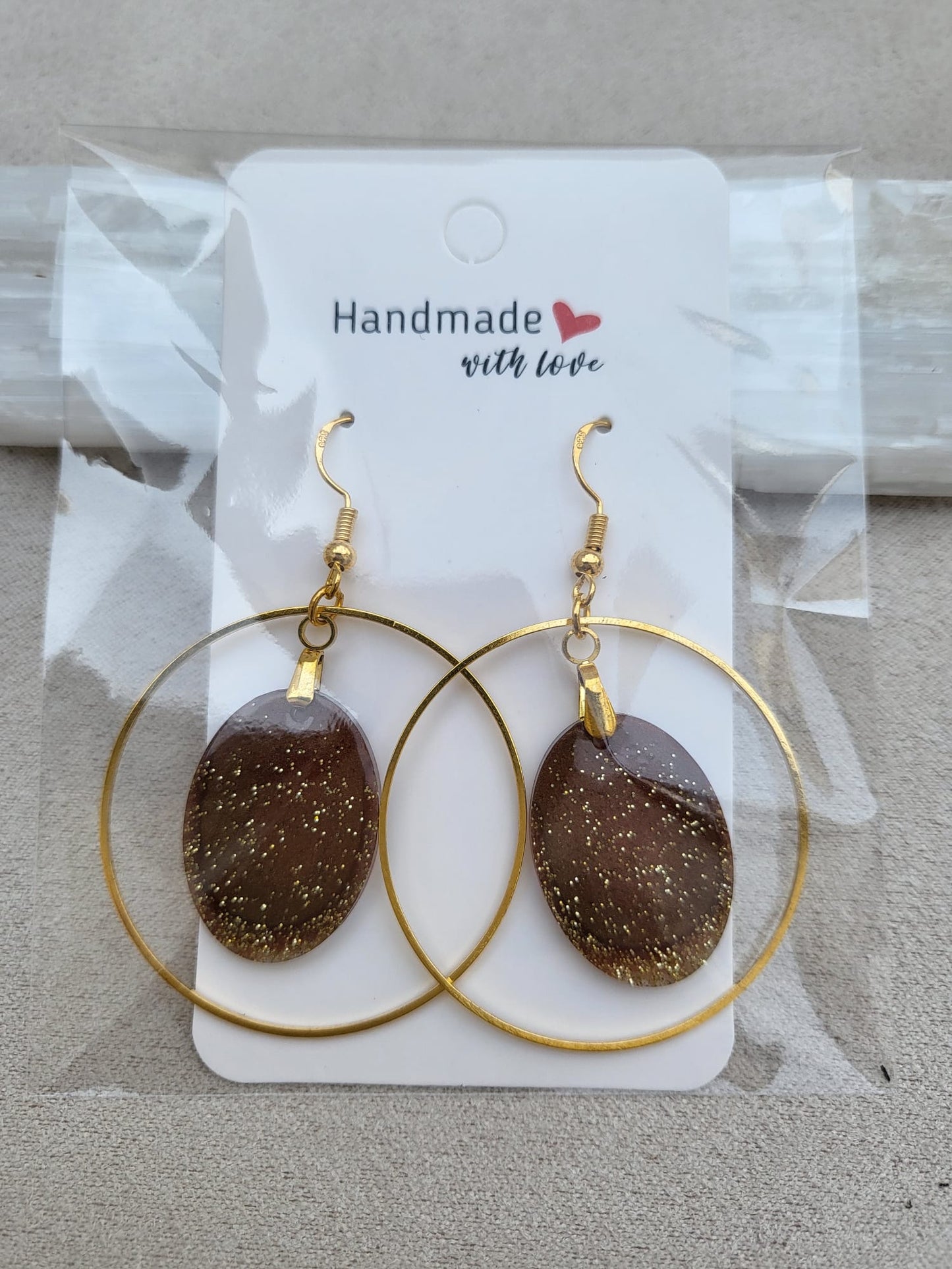 GOLDEN BROWN OVAL earrings.