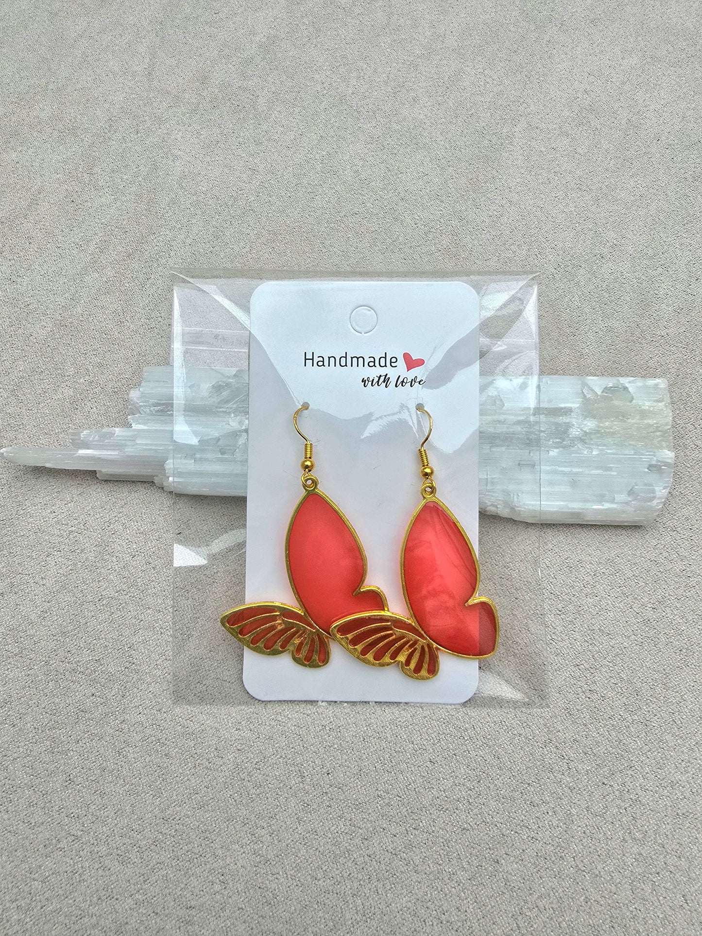 CARMINE BUTTERFLY earrings.