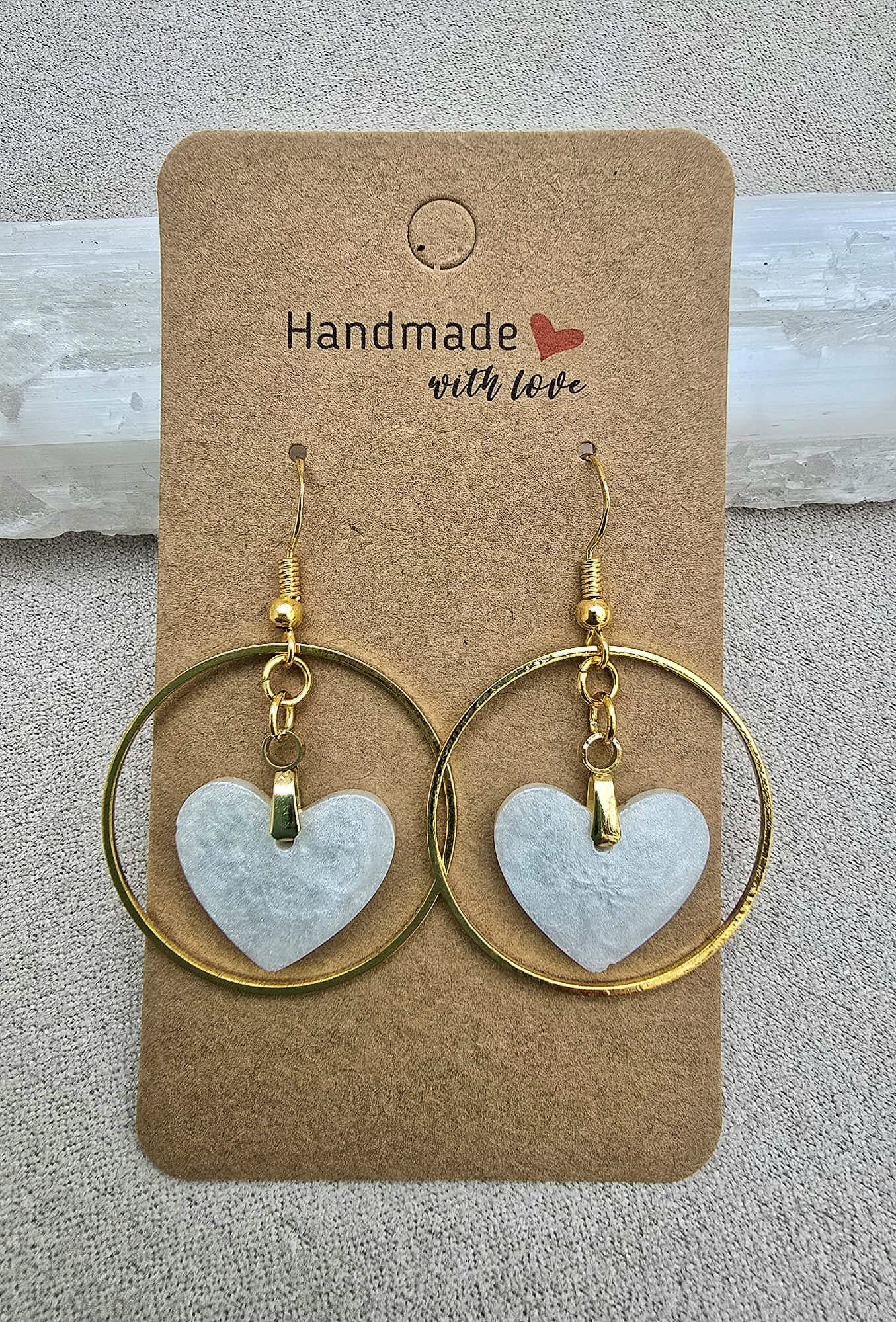 MOTHER-OF-PEARL HEART earrings.