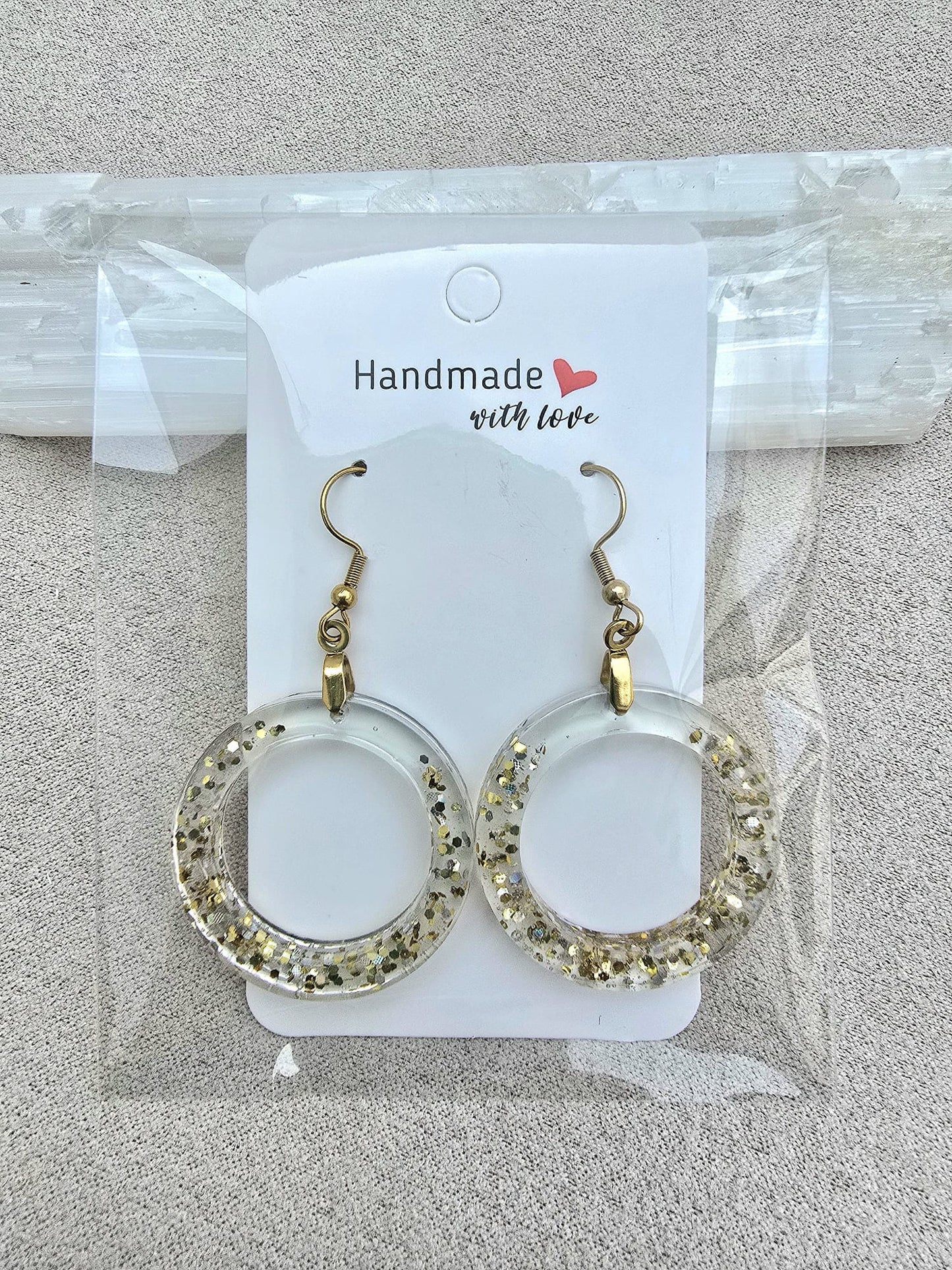 LUMINOUS HOOP earrings.