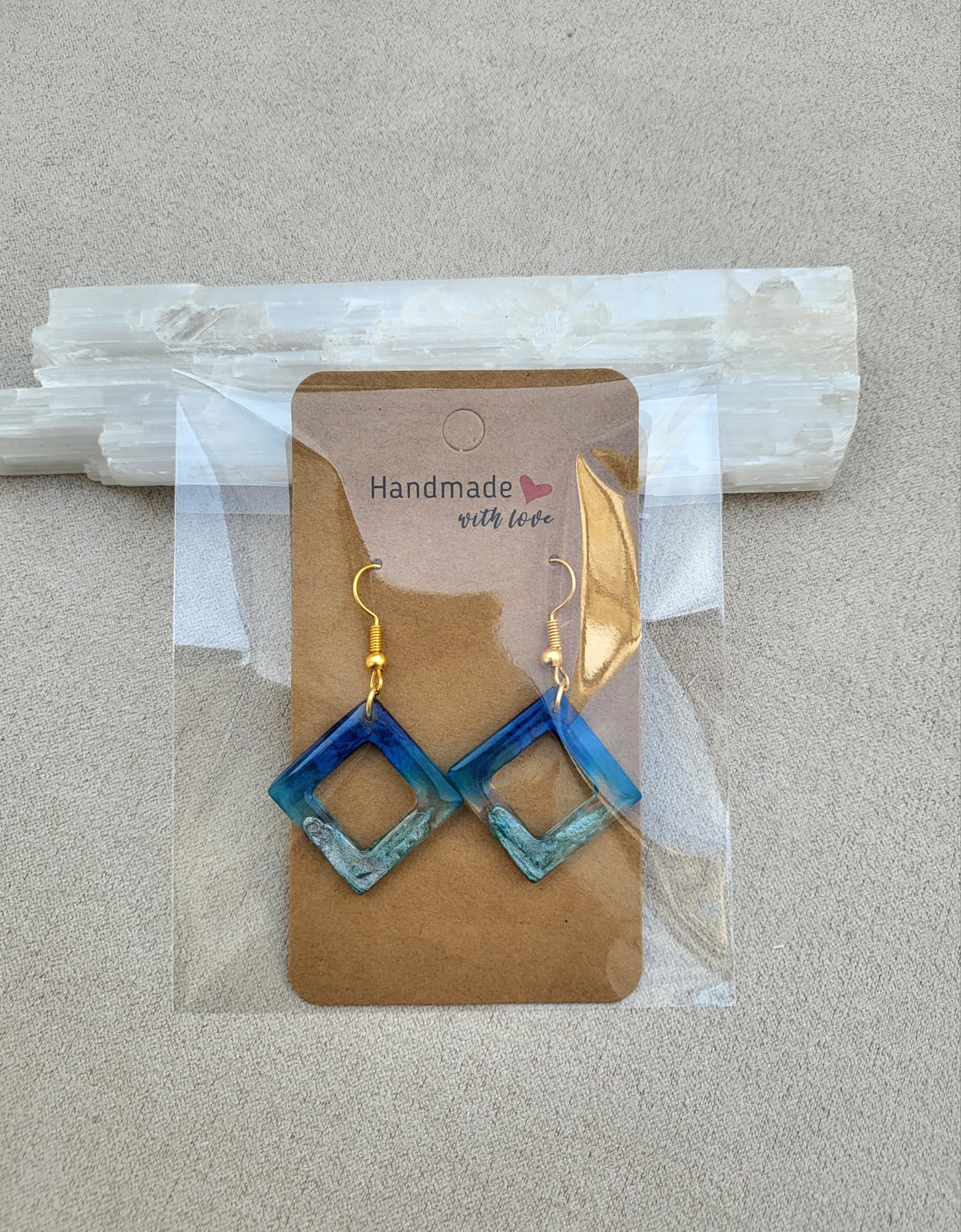 FRAMED WAVE earrings.